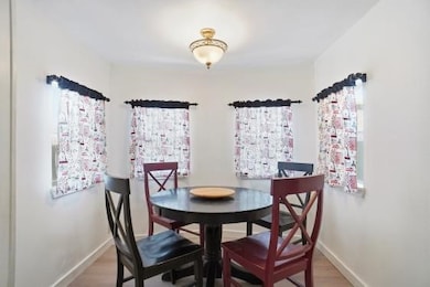 Dining space featuring wood finished floors and healthy amount of natural light