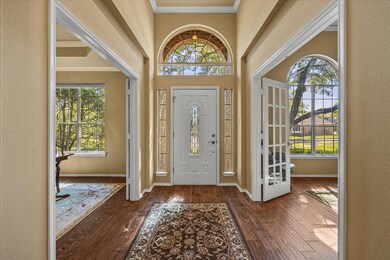 Impressive entry opens onto living and dining area