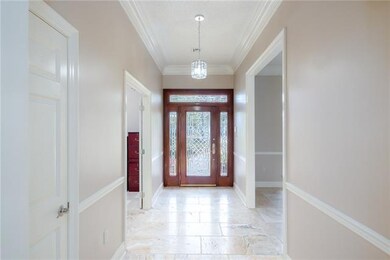 Walk through the front door to a wide inviting foy