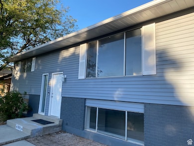 FRONT view of property with brick siding