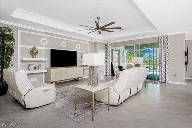 Tiled living area featuring ceiling fan, ornamenta