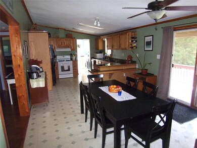 Dining area with sliding glass doors leading to de