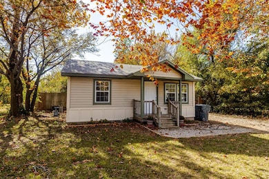 Bungalow-style house featuring roof with shingles