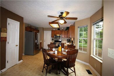 Kitchen has stainless appliances, pantry and an ea