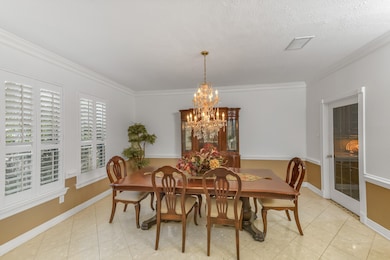 he formal dining room in this home exudes sophisti