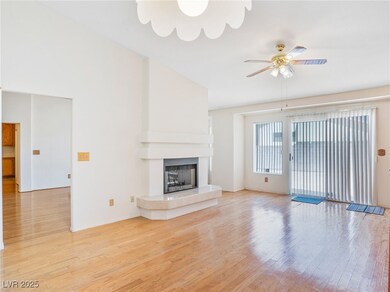 Unfurnished living room featuring a tiled fireplac
