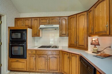 Nice wood cabinets, with updated microwave, oven &