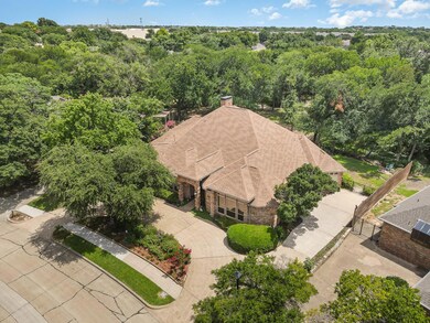 Large side entry garage with 3rd garage area that can be used for car, golf cart, riding mower, or hobby work shop.