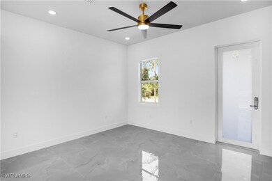 Spare room with marble finish flooring, recessed l