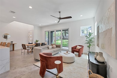 Living area featuring visible vents, recessed lig