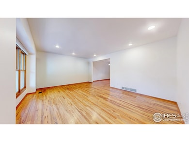 Bright and open living room with beautiful wood floors