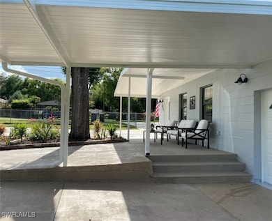 View of patio / terrace featuring fence and a porc