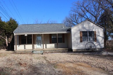 Single story home with covered porch