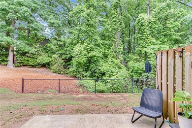 View of yard featuring fence and a patio