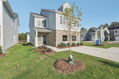 View of front of property with a garage and a fron