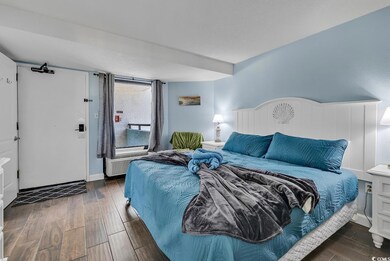 Bedroom featuring dark wood-type flooring