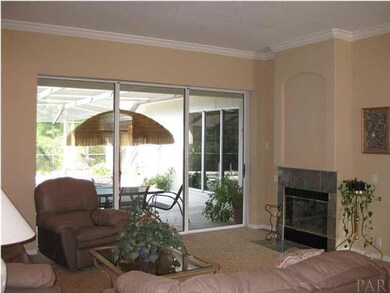 The formal living room has a disappearing wall of glass to the lanai and a 2-sided fireplace to the morning room.