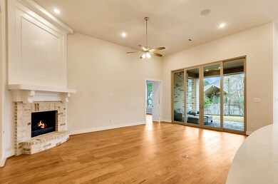 Brick gas fireplace with white mantle accents the