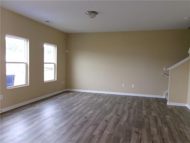 Unfurnished living room with wood finished floors,