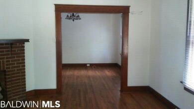 Living room looking into dining room. Original mol