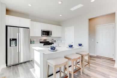 This amazing kitchen has an abundance of cabinet space AND a large walk-in pantry. Note: Home will include cabinet hardware and tile backsplash. *Photo is of model home. Actual finishes may vary.
