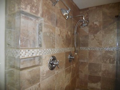 Custom designed with dual head tile shower.