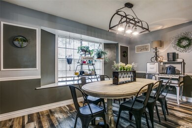 Dining area with large bay window. New paint throughout home