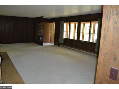 Living room from hallway, you can see front porch.