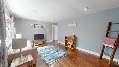 View of hardwood floored living room, modern paint
