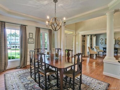 Dining Room opening to the foyer and shows the det