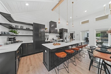 Kitchen featuring pendant lighting, light wood-typ