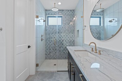 Bathroom with plenty of natural light, a shower s