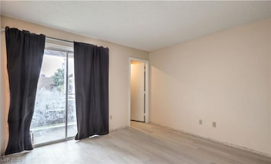 Unfurnished room featuring wood finished floors an