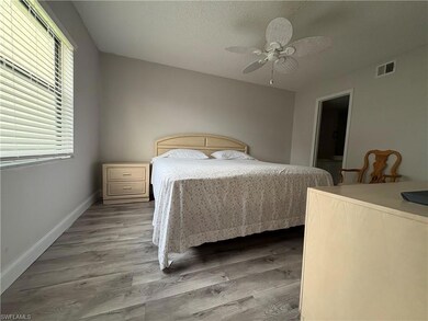 Bedroom featuring light wood-style flooring and a ceiling fan