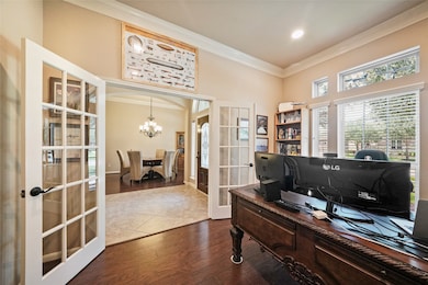 Private study features french doors, can lighting & large picture window.