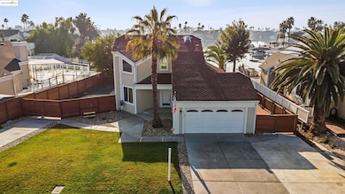 View of front facade featuring stucco siding, concrete driveway, a fenced backyard, an attached garage, and a residential view
