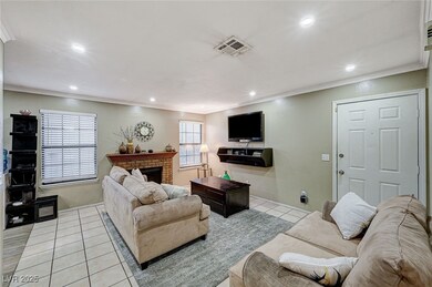Living room featuring light tile patterned floors,