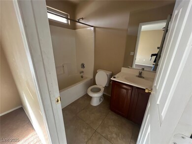 Full bath with tile patterned flooring, toilet, va