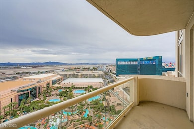 Balcony featuring a view of city, view of pool, and a mountain view