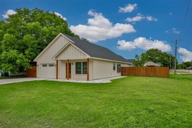 View of front of property featuring a garage and a