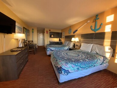 Bedroom featuring dark carpet
