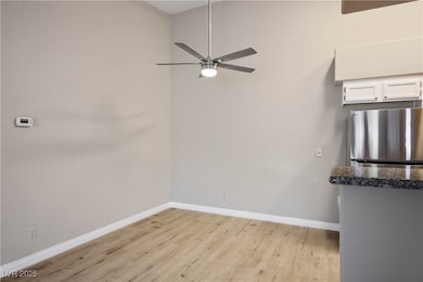 Unfurnished room with light wood-style flooring, b