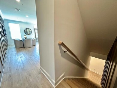 Stairs with trim detail leading to main level living *Photos shown are from same floor plan, but different staged home*