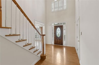 Foyer Featuring Large Second Story Window Allowing