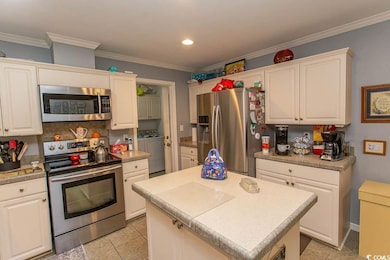 Kitchen featuring light tile patterned floors, cro