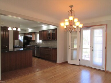 French Doors Off of Dining Room lead to Stamped Pa