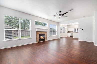 This spacious family room features elegant floors,