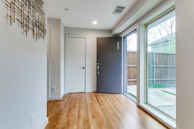 Spacious foyer has coat closet and half bath
