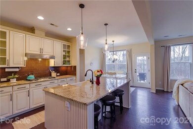Large island, Backsplash, and Gas Range in kitchen