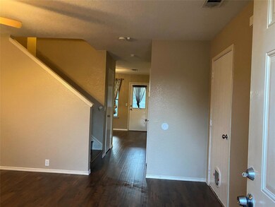 Empty room featuring dark wood-type flooring